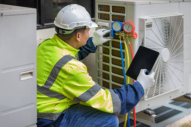 Professional Heat Pump Repair technician working in Marion, MA